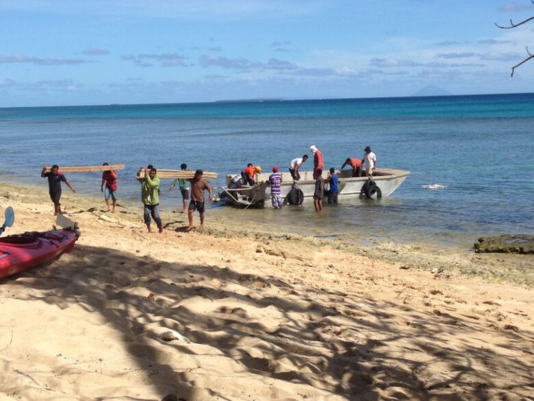 hauling it up the beach